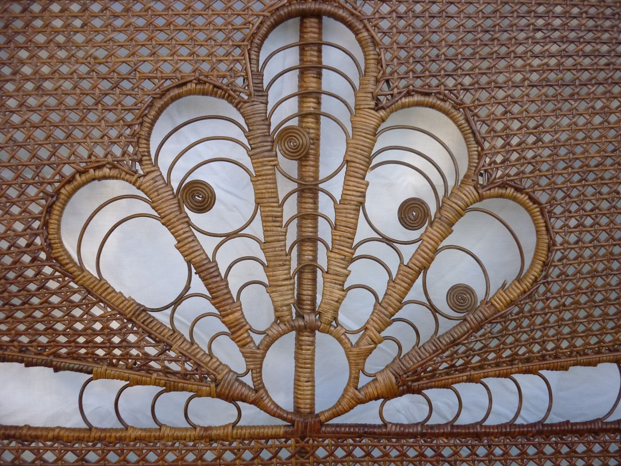 Braided and caning head of bed in wicker and rattan peacock