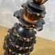 Large pineapple table lamp in carved black and gold wood, France, early 20th century.