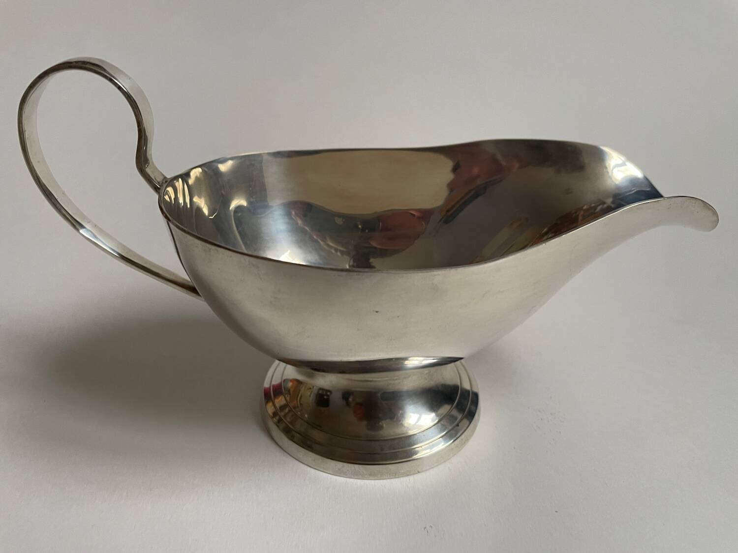 Silver metal sauce boat