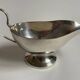 Silver metal sauce boat