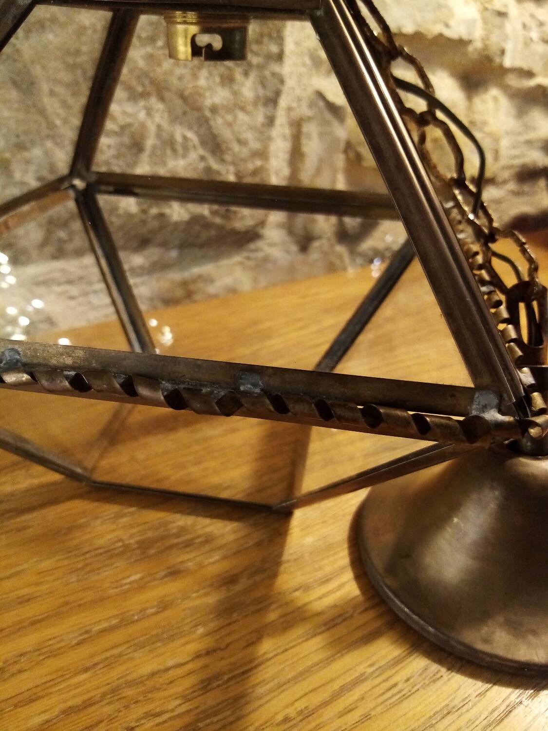 Glass and brass suspension