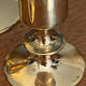 Set of candlesticks and tubular vases in solid brass.
