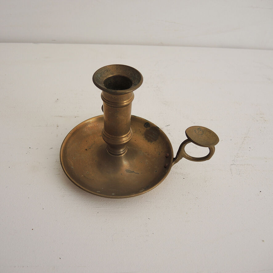 Old hand-push brass candlestick