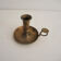 Old hand-push brass candlestick