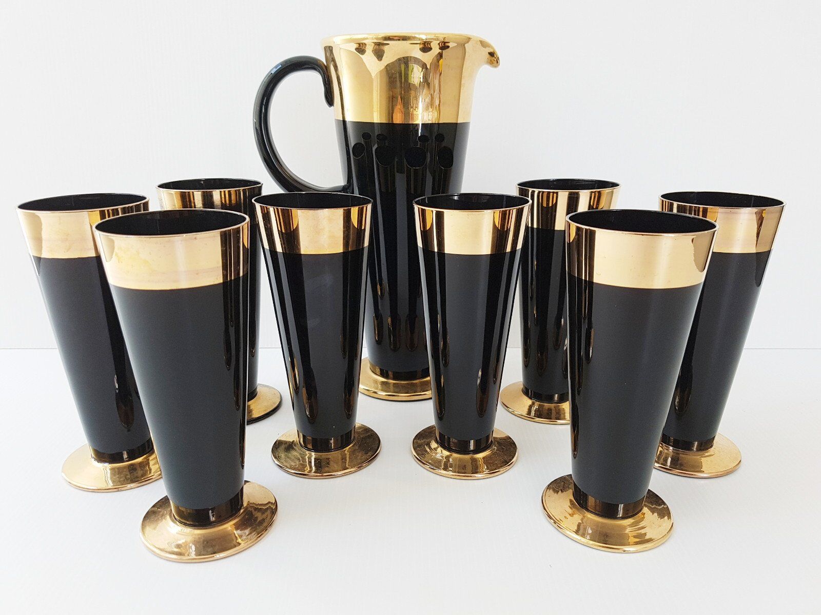 Vintage 1950s black and gold glass lemonade service.