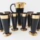 Vintage 1950s black and gold glass lemonade service.
