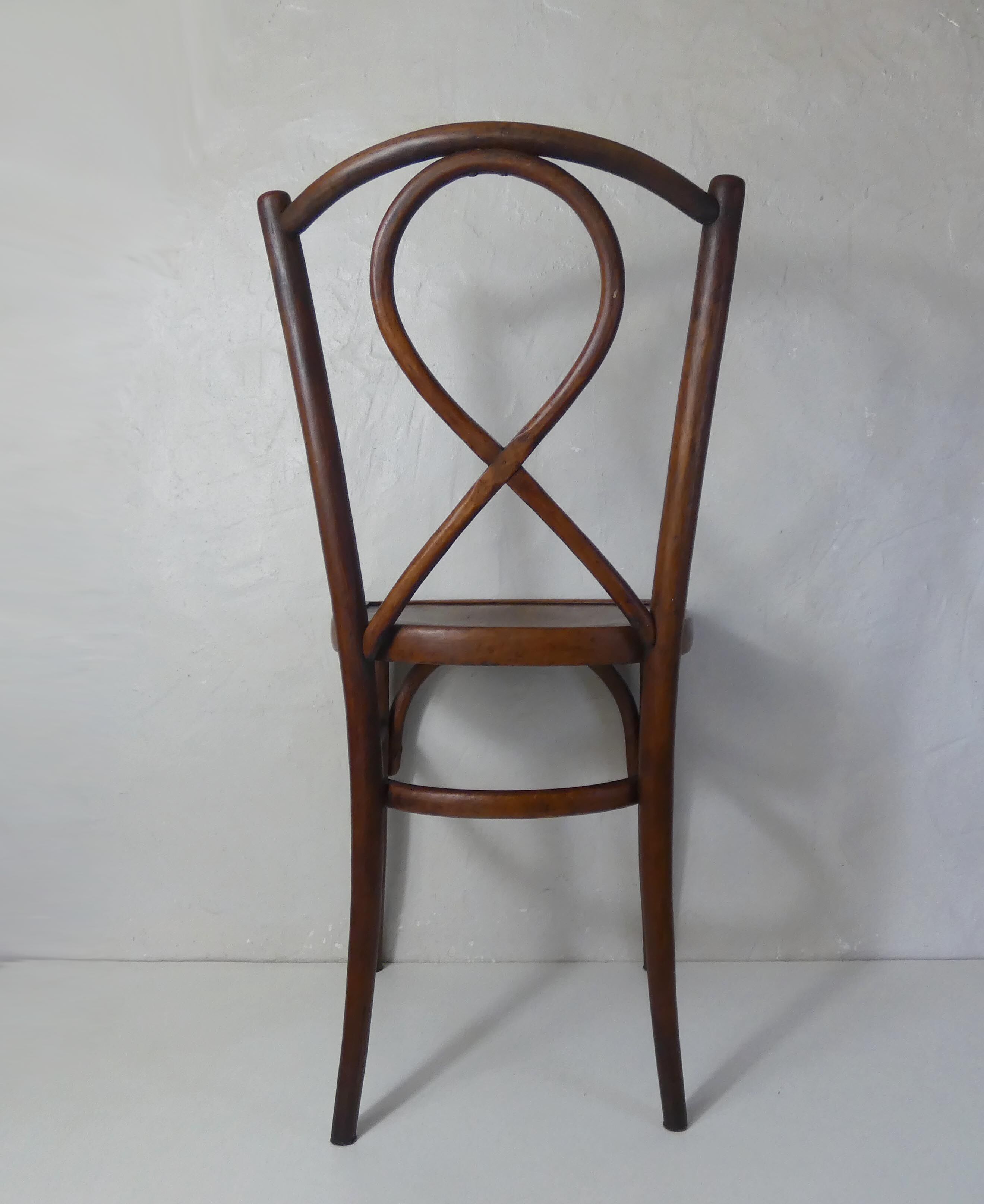 Old curved wooden bistro chair