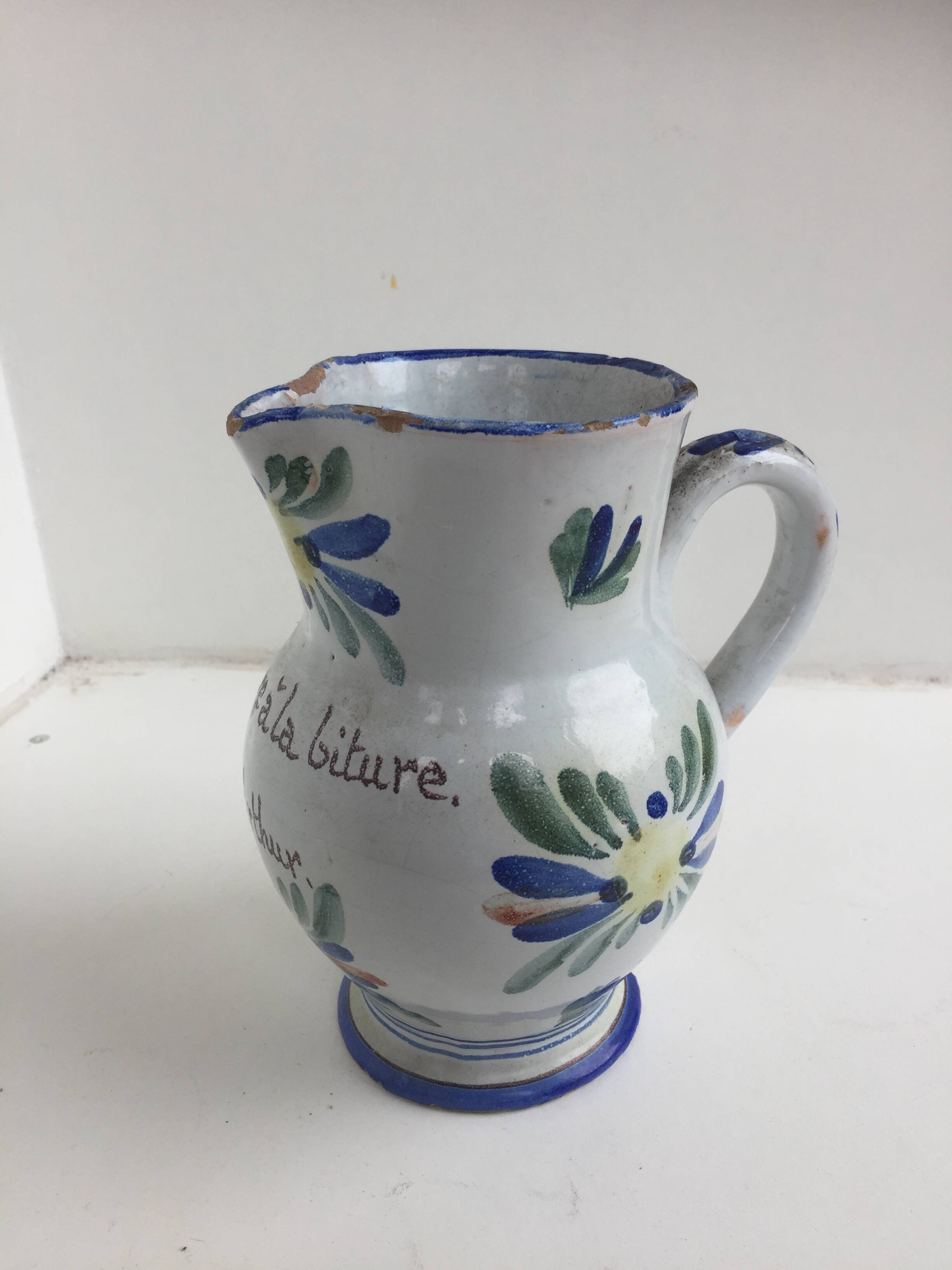 Old earthenware pitcher Beware at the Arthur biture