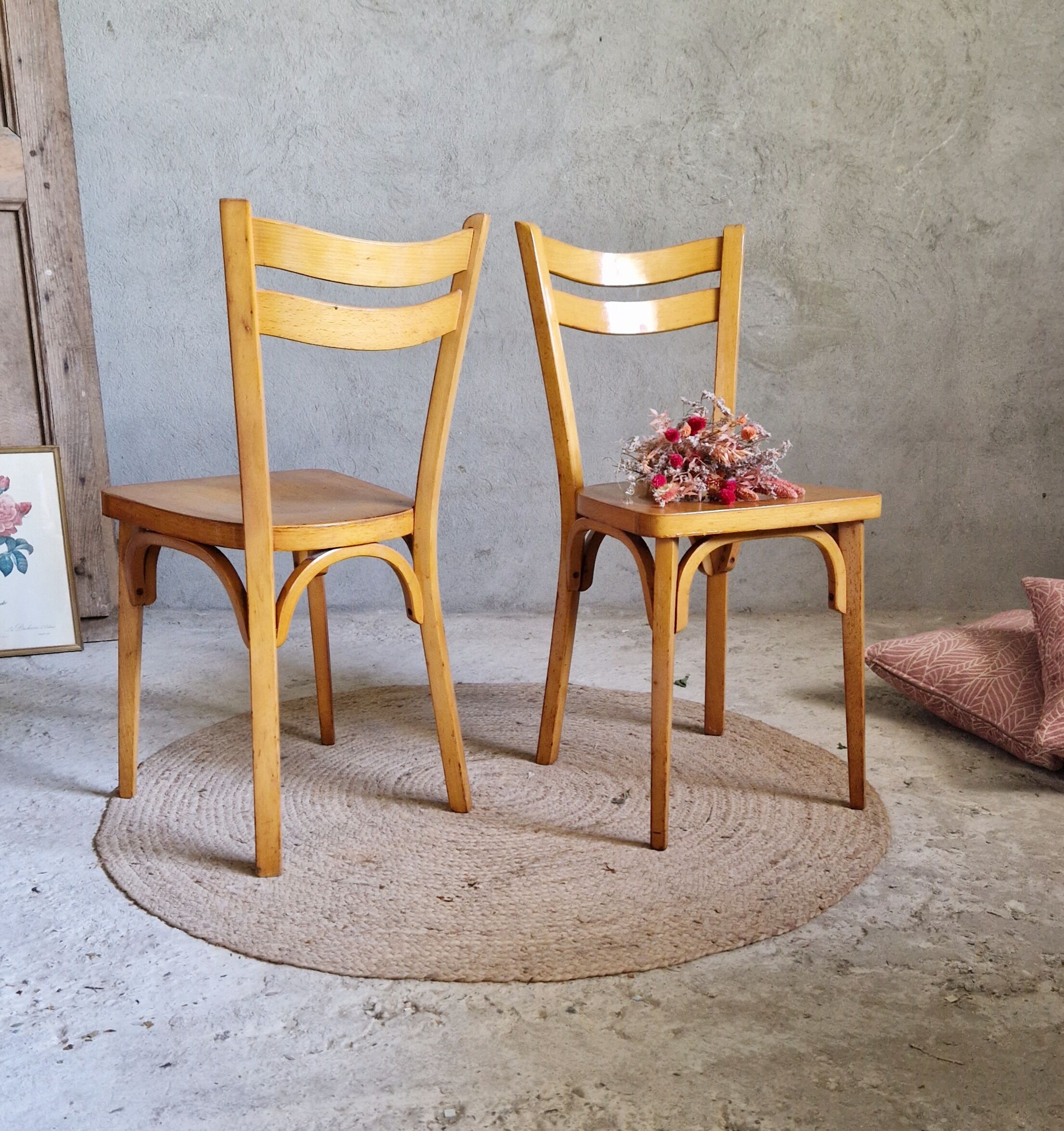 Old and pretty pair of Baumann bistro chairs