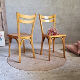 Old and pretty pair of Baumann bistro chairs