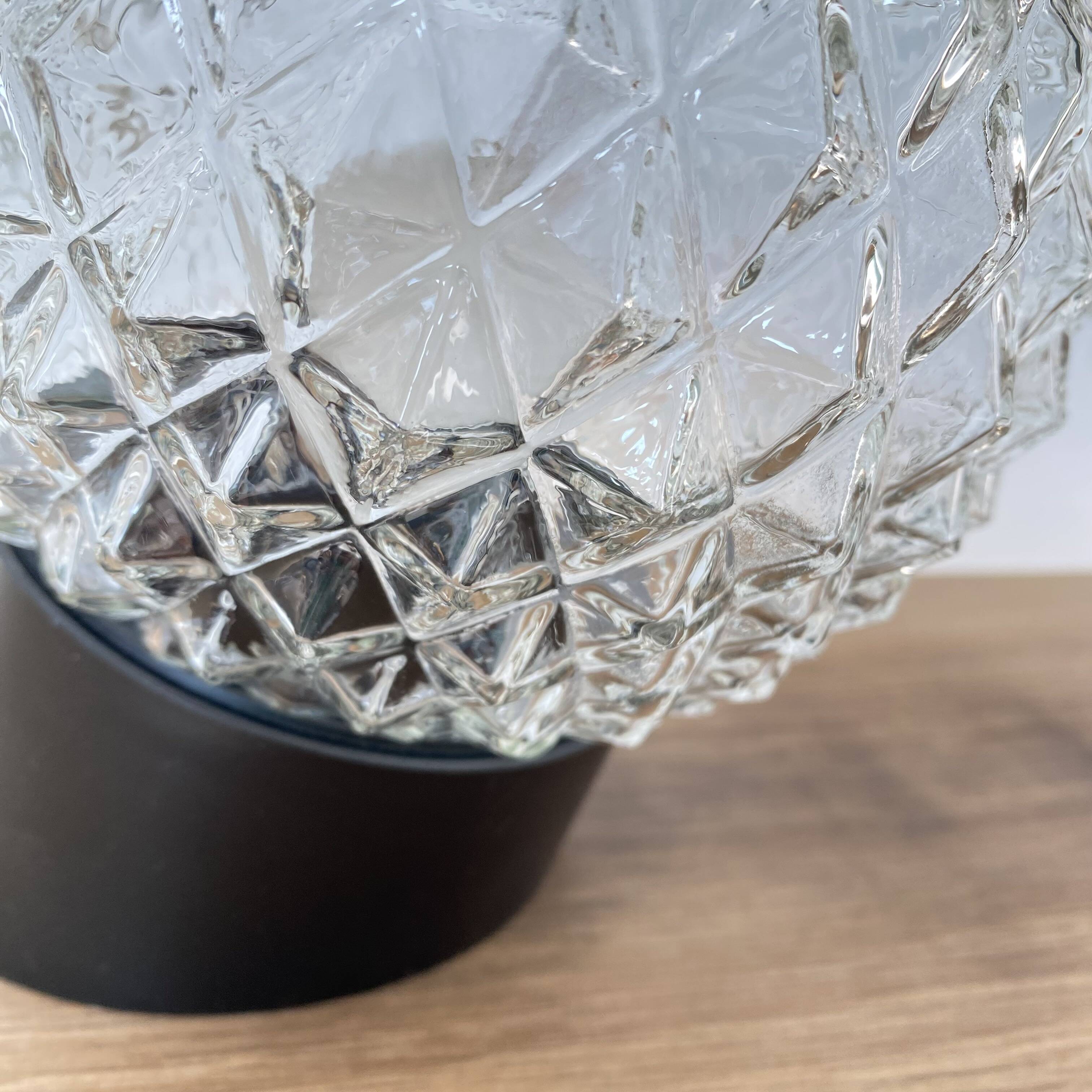 Pair of slanted glass wall lights with black plastic base, decorative v