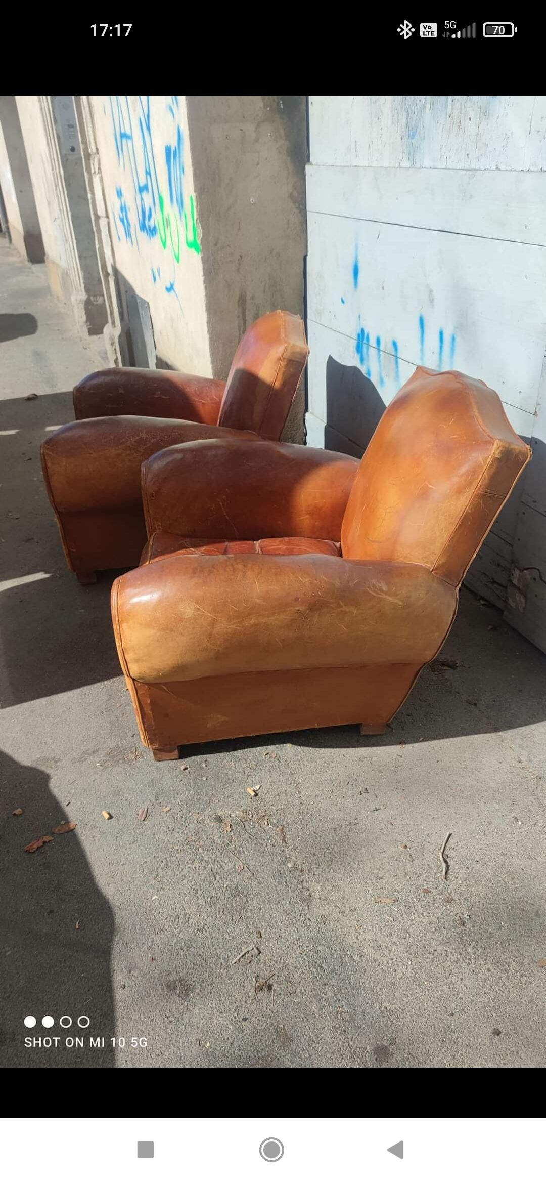 Pair of club chairs with moustache-shaped handles in Havana leather, in their original condition, circa 1930
