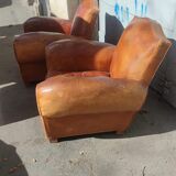 Pair of club chairs with mustaches in havana leather in their juices circa 1930