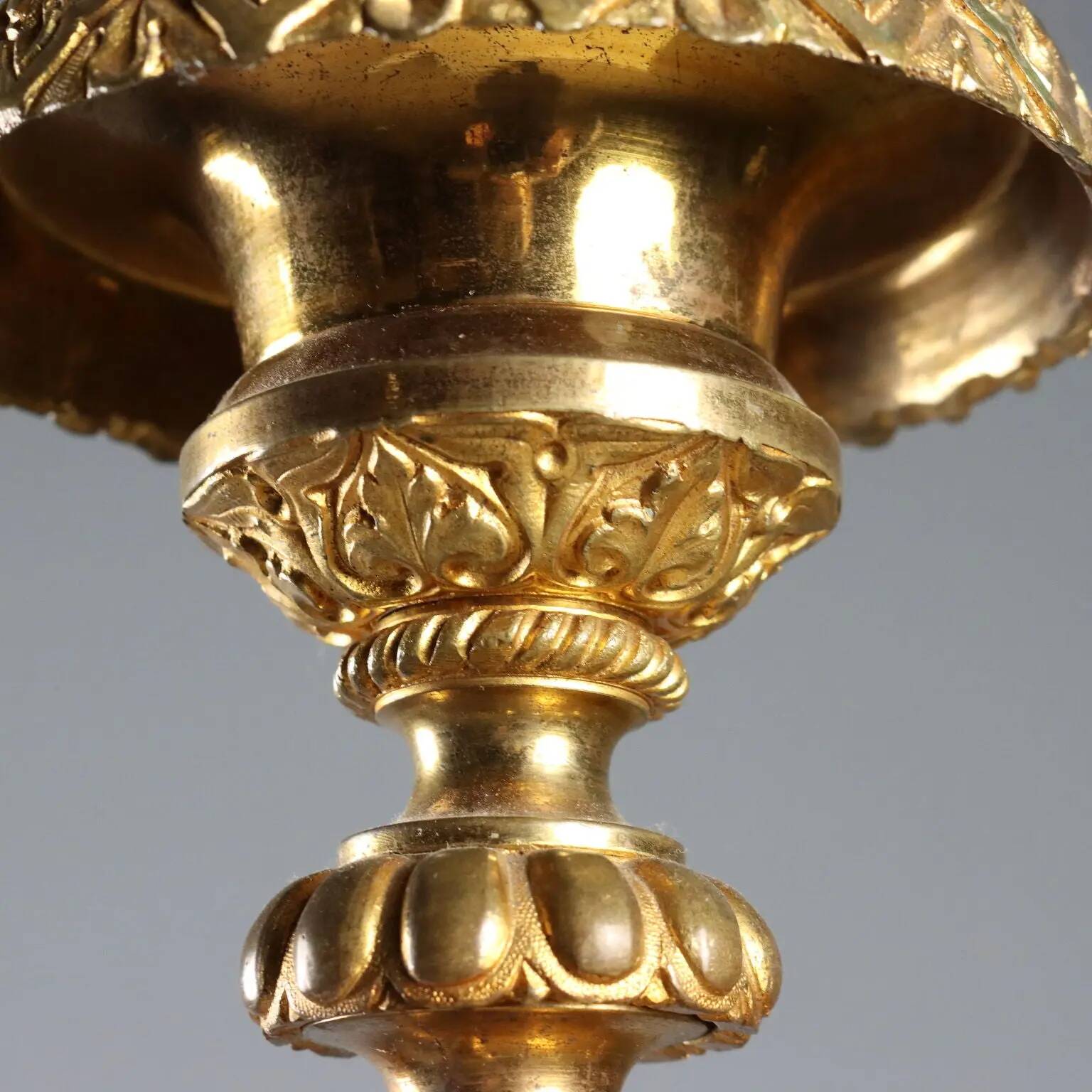 Antique gilded bronze candelabrum, 19th-century decorations.