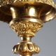 Antique gilded bronze candelabrum, 19th-century decorations.