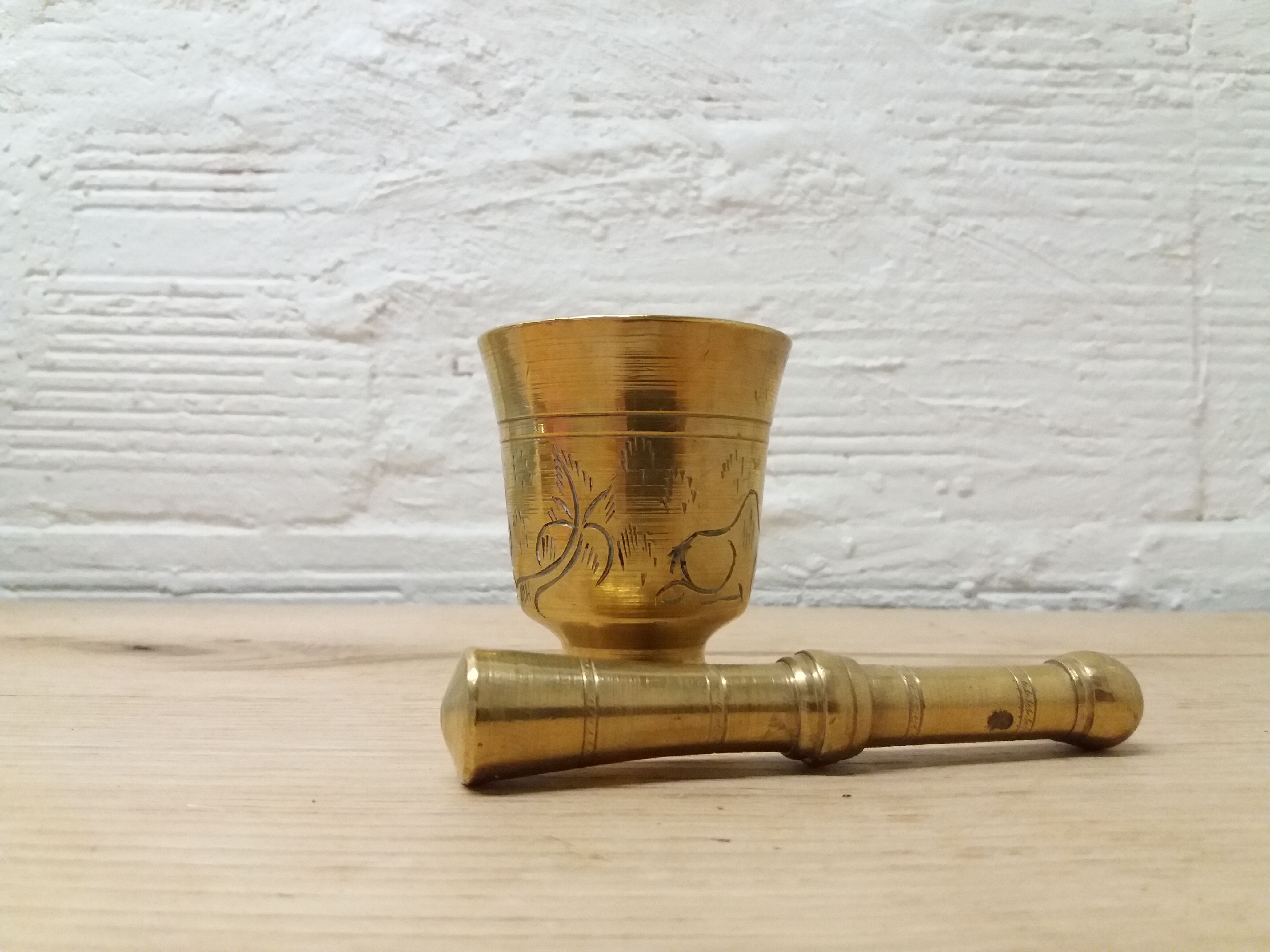 Golden brass mortar and pestle