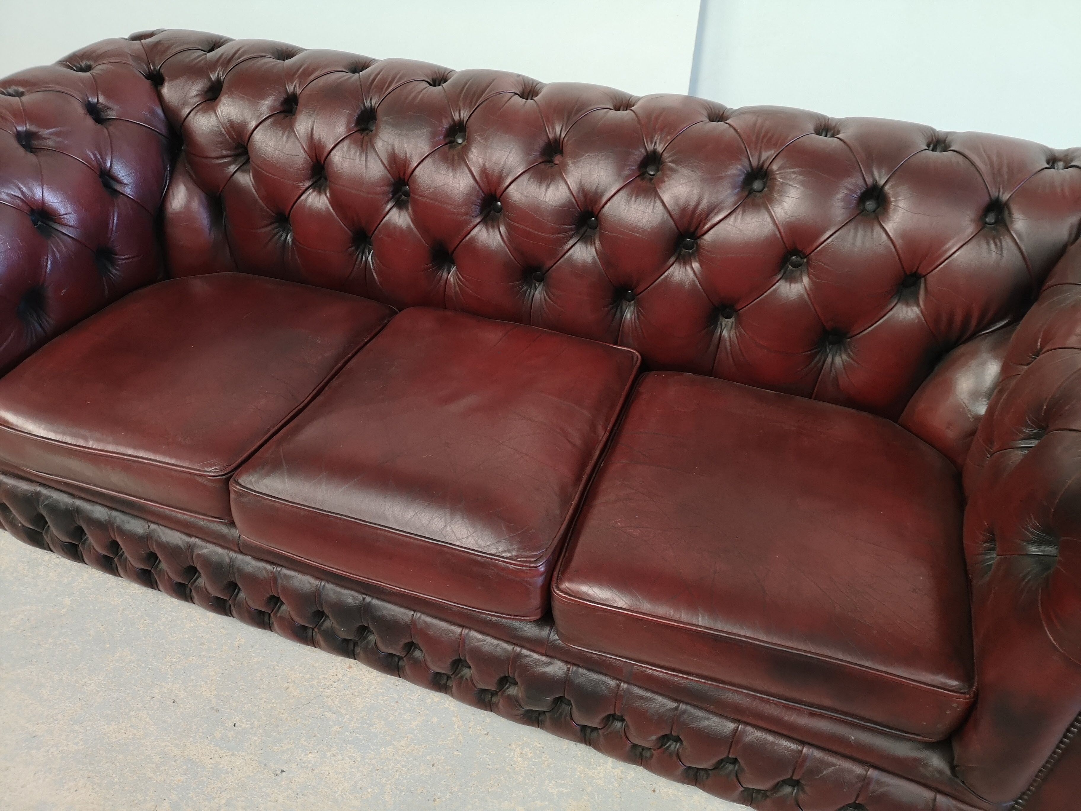 Burgundy leather chesterfield sofa