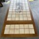 Vintage extendable dining table in wood and ceramic – 1970s