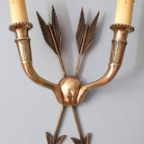 Vintage wall lamp decorated with bronze arrows