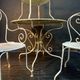 Set of wrought iron garden furniture