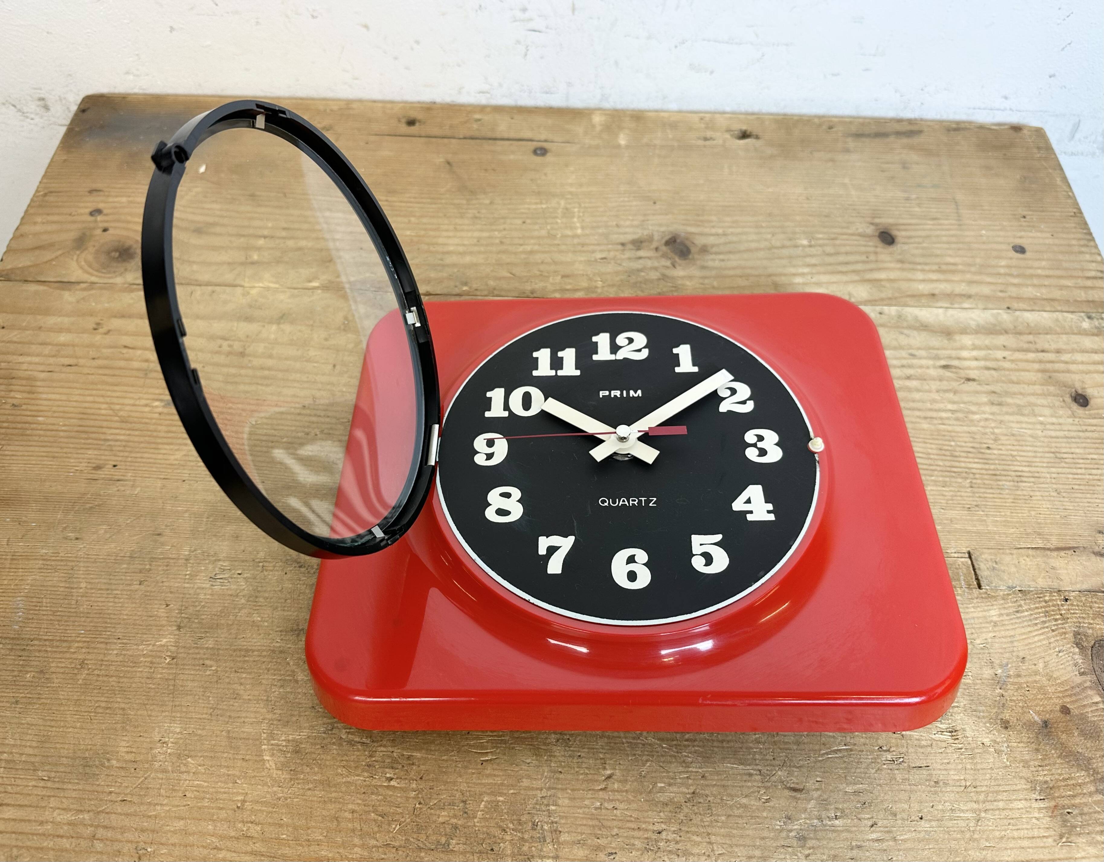 Vintage red bakelite wall clock from prim, 1970s