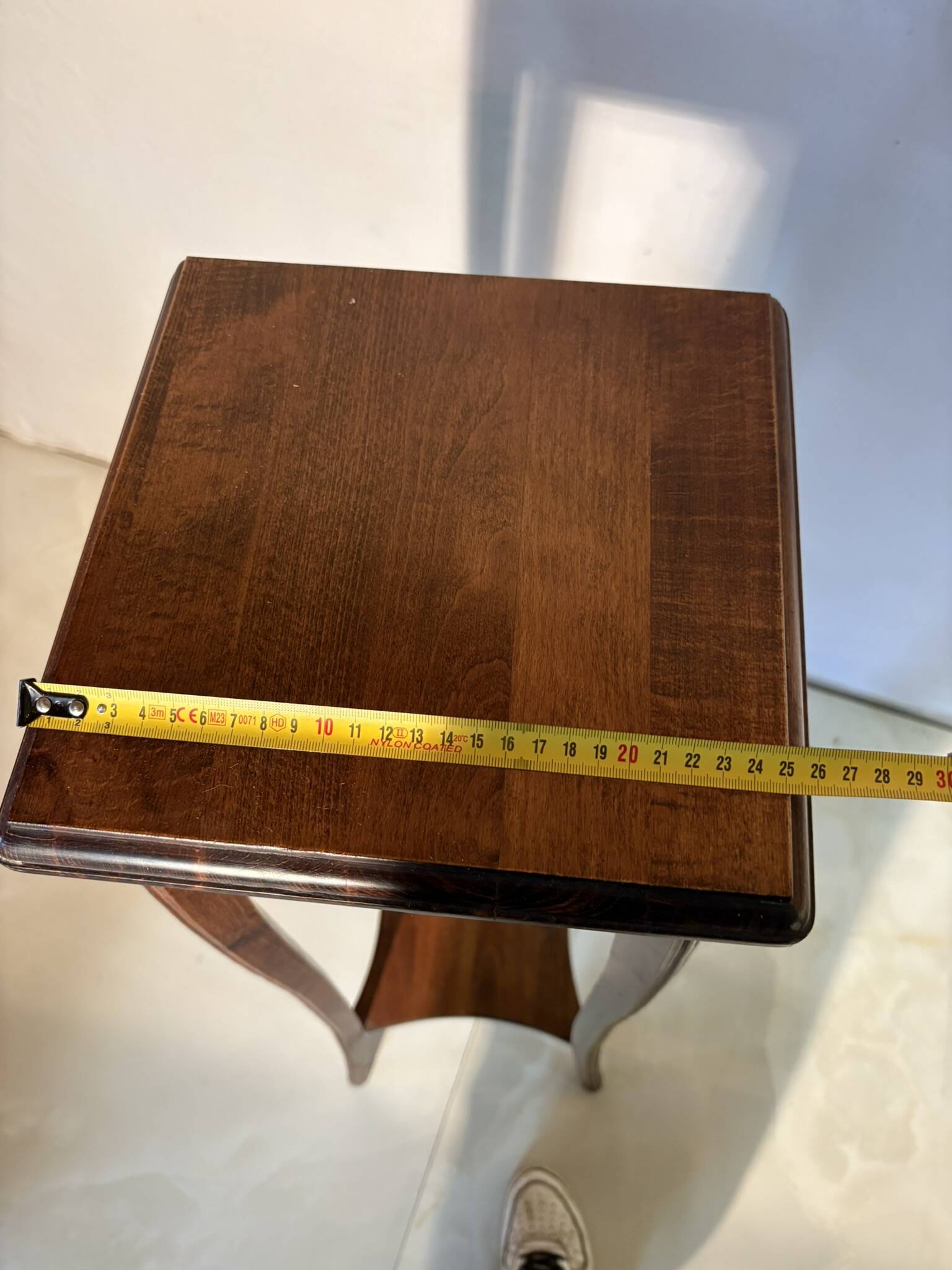 Vintage dark wood side table with curved base