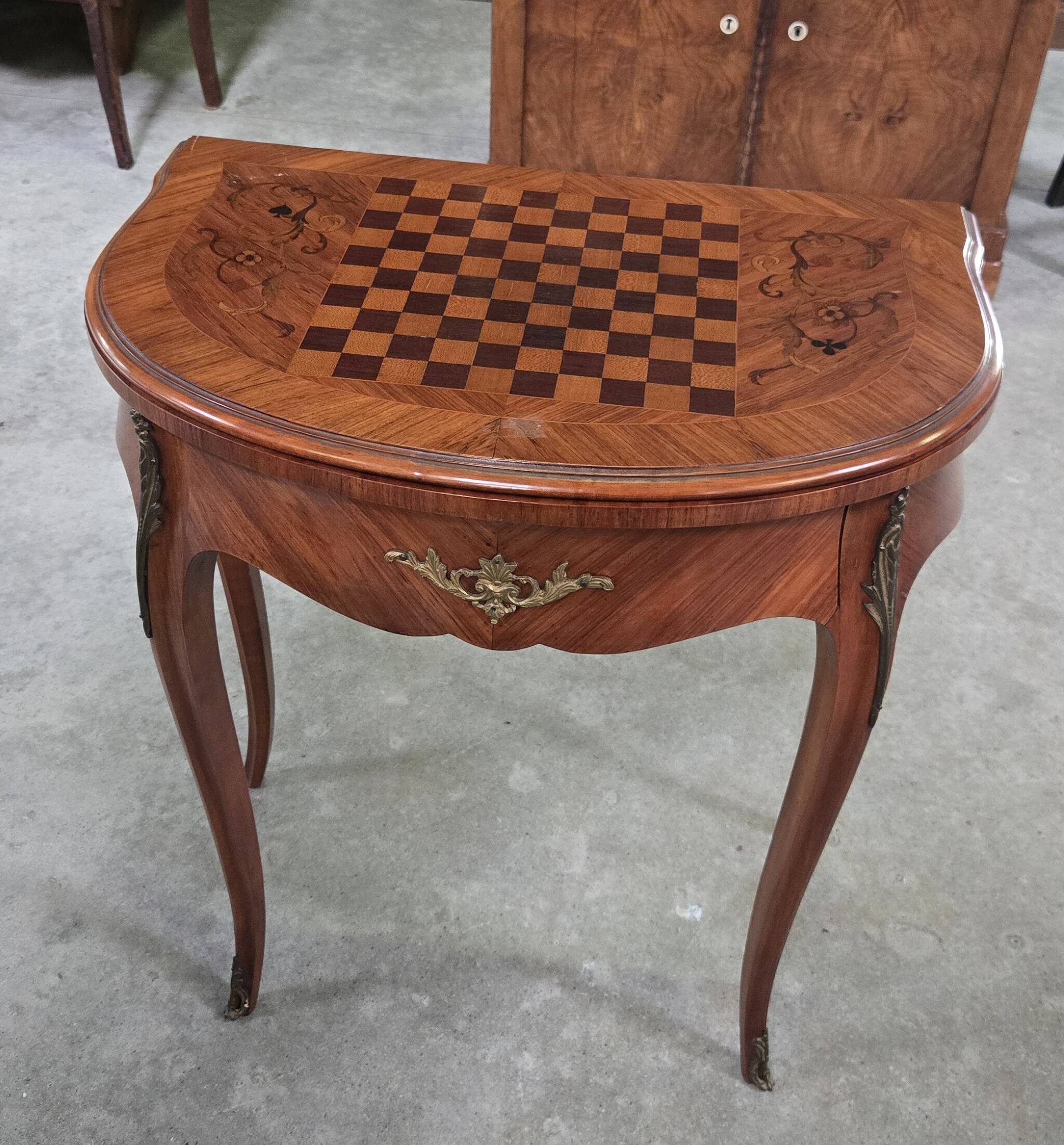 Half-moon gaming table in Louis XV style, made of precious wood marquetry.