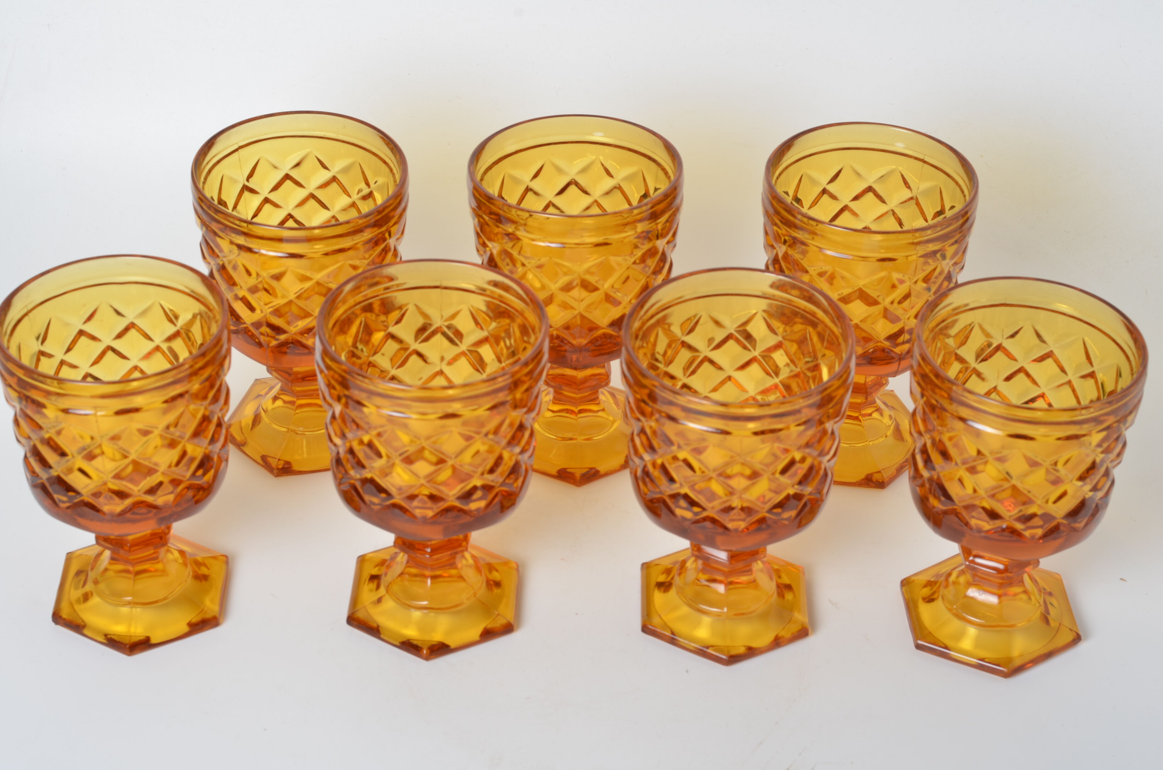 7 amber stemmed glasses