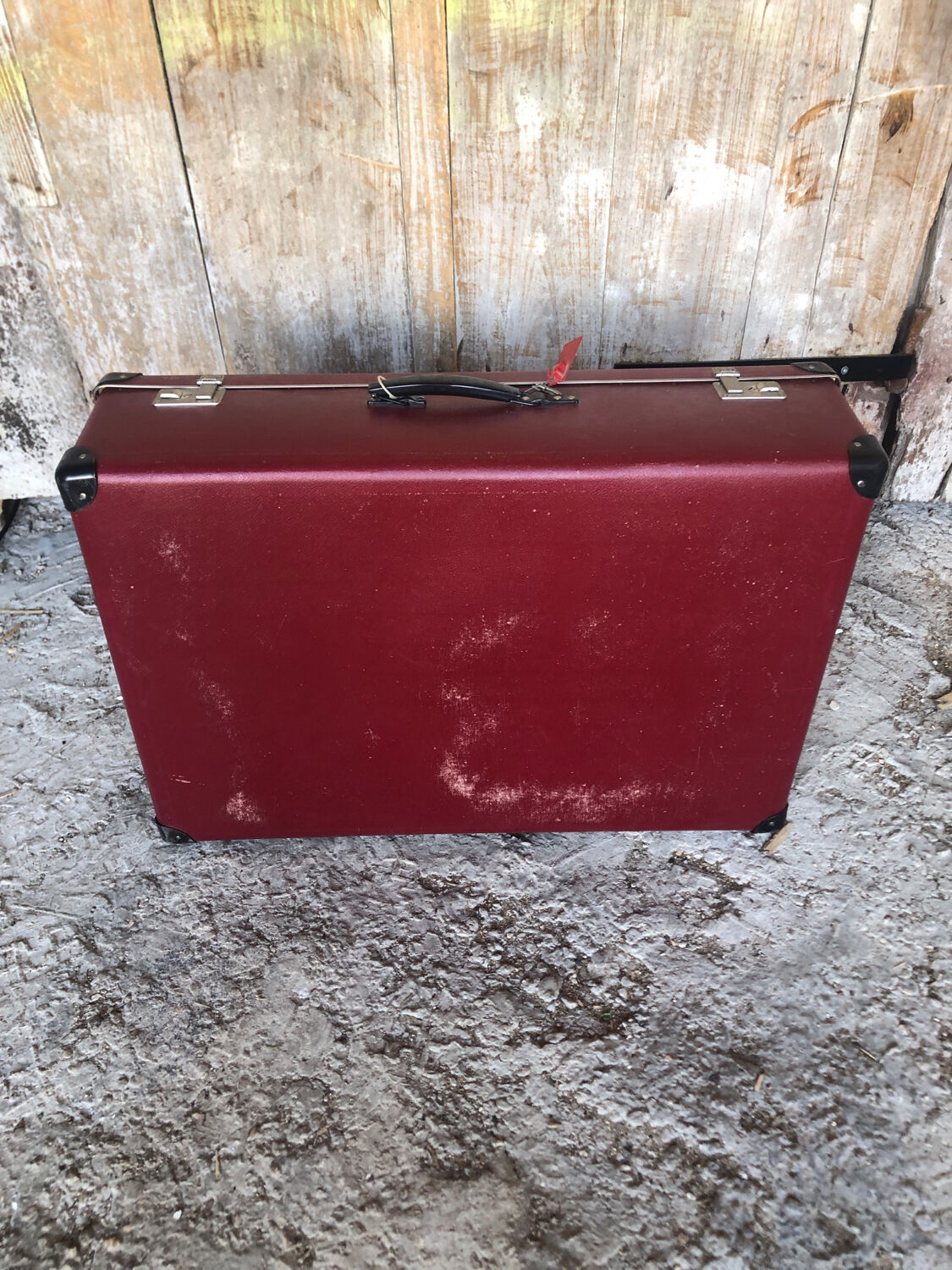 Old suitcase red cardboard bordeaux clasp metal vintage