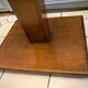 Square pedestal table with central foot 1930