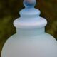 Blue frosted glass bottle/vase on foot