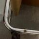 1970s/80s coffee table on casters with metal tubing, light-colored door