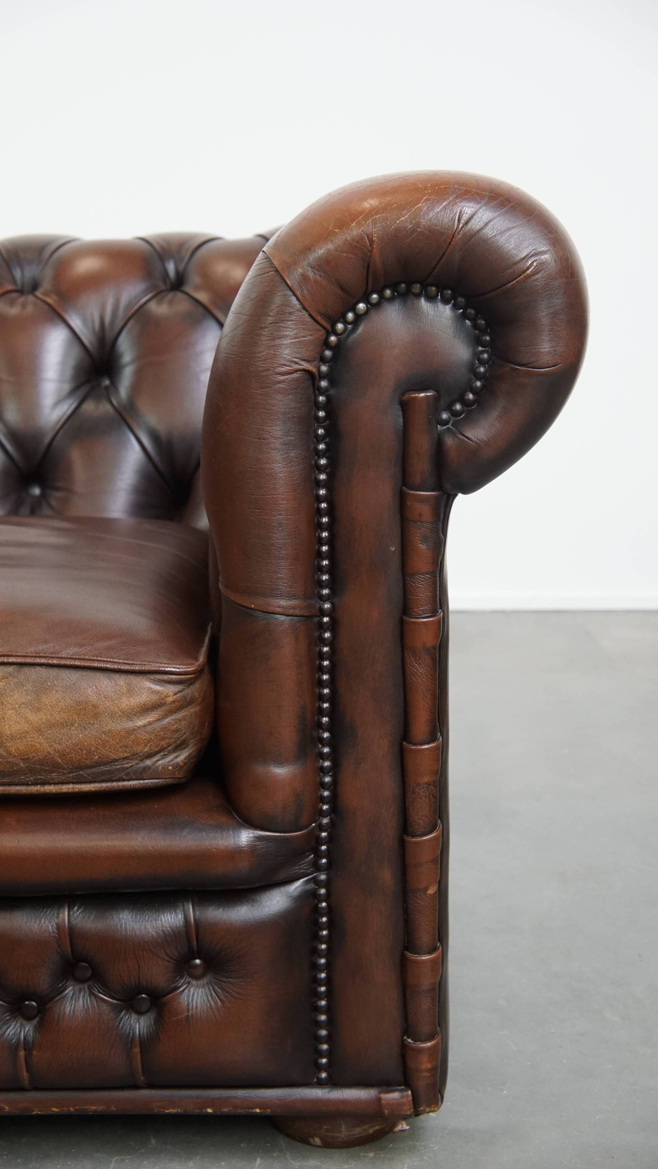 Dark brown English cowhide leather chesterfield armchair