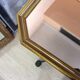 Miroir octogonal doré