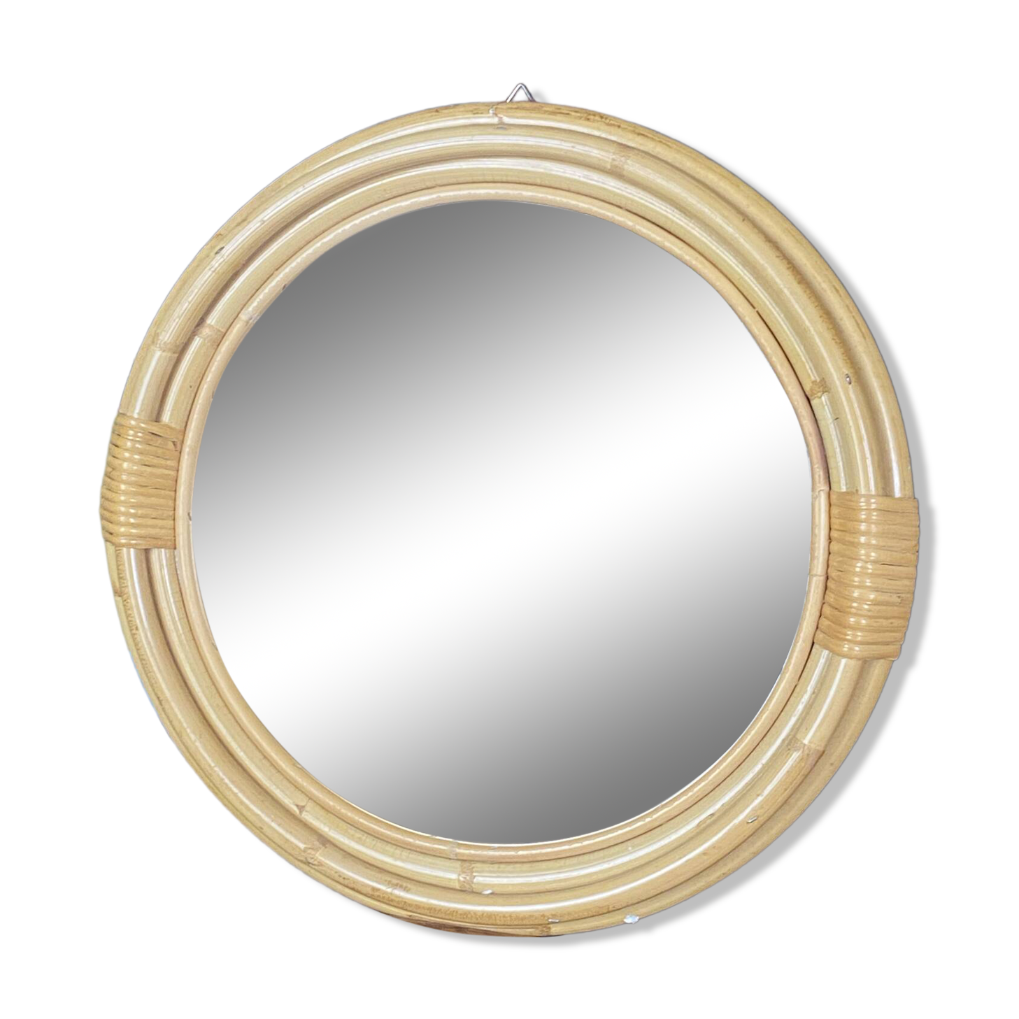 Round mirror from the 1960s with a frame made of rattan and metal.