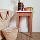 Wooden wax stool and orange formica