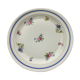 Round serving dish "lourioux foëcy" with flower motifs.