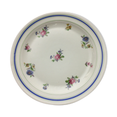 Round serving dish "lourioux foëcy" with flower motifs.