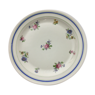 Round serving dish "lourioux foëcy" with flower motifs.
