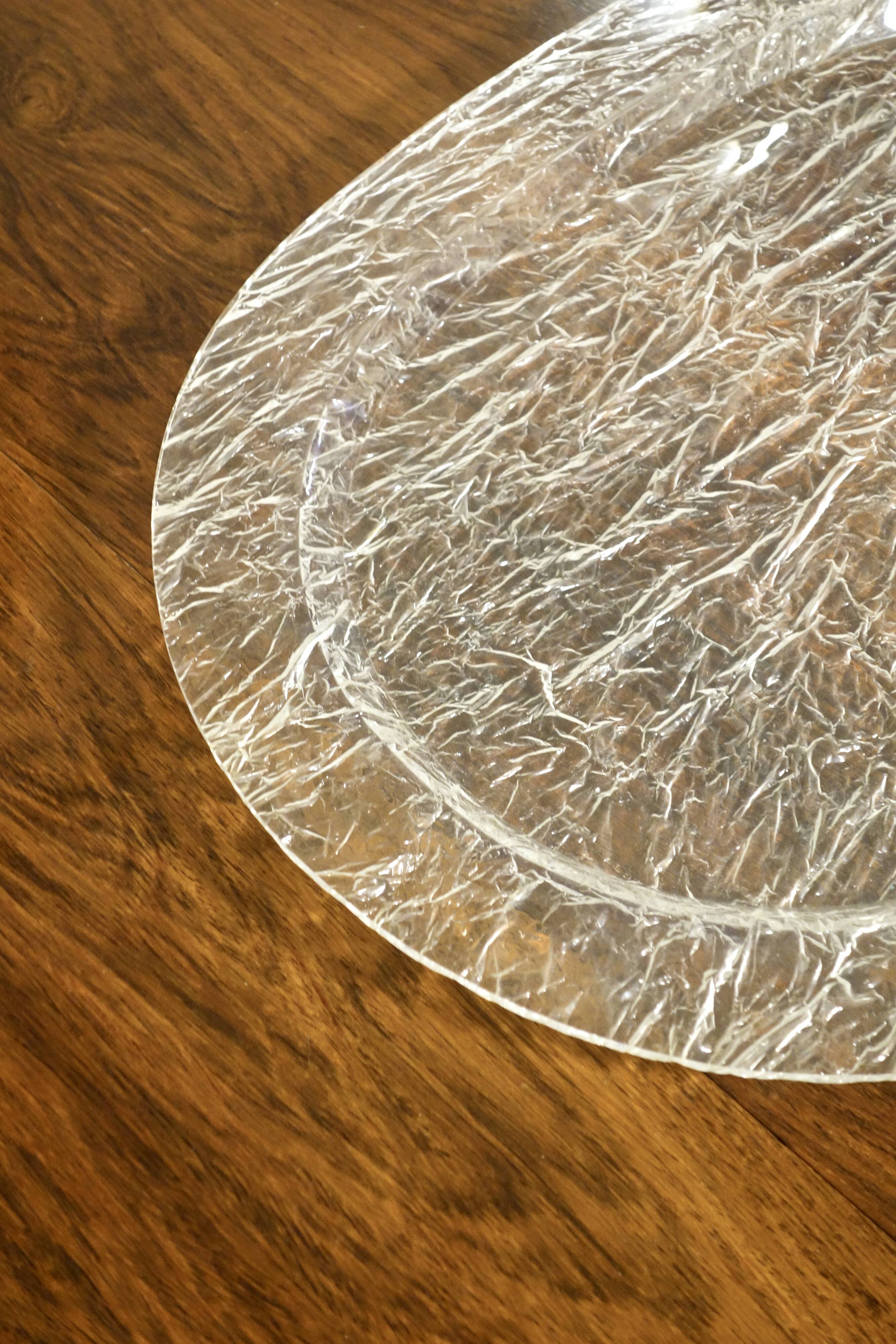 Large oval tray in crumpled plexiglass, France 1970's