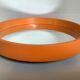 Old vintage orange round mirror