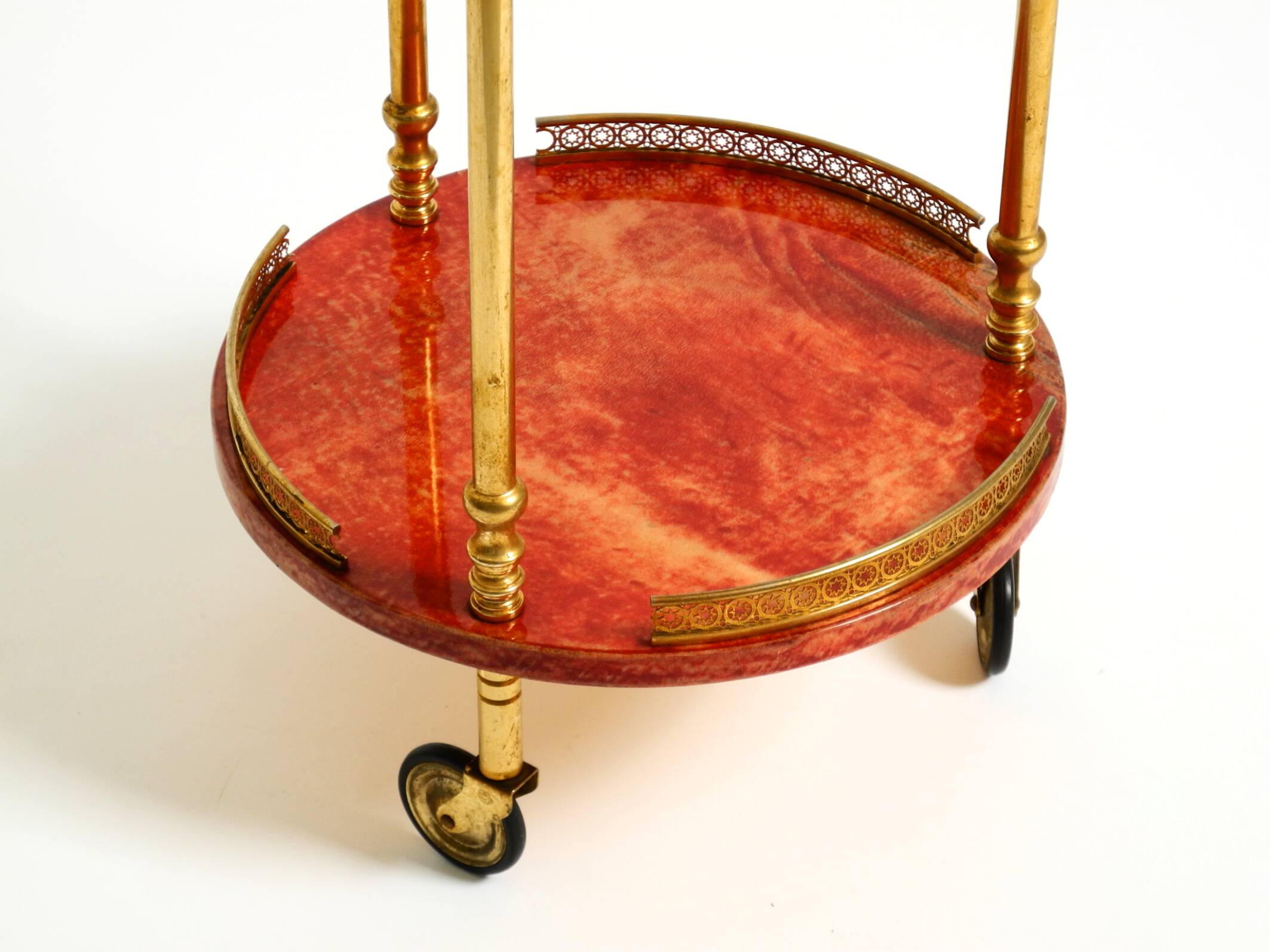 Round, small 1960s Aldo Tura serving or bar trolley in red goatskin leather