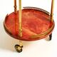 Round, small 1960s Aldo Tura serving or bar trolley in red goatskin leather