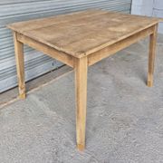 Old farmhouse table with its 2 extensions and raised legs.