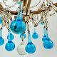 Italian chandelier with blue beads and gilded wood.
