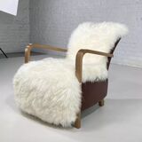 Scandinavian style armchair in leather and hide