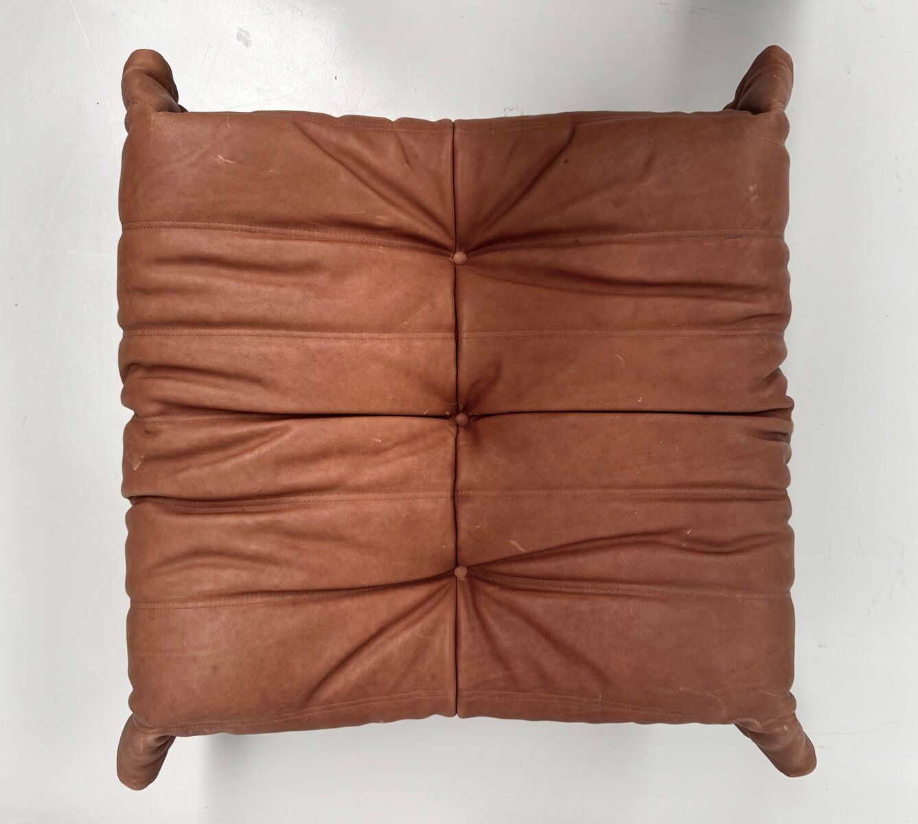 French Togo ottoman in cognac neck leather attributed to Michel Ducaroy for Ligne Roset
