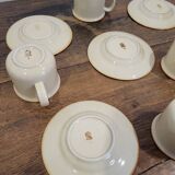 5 enameled stoneware cups and saucers