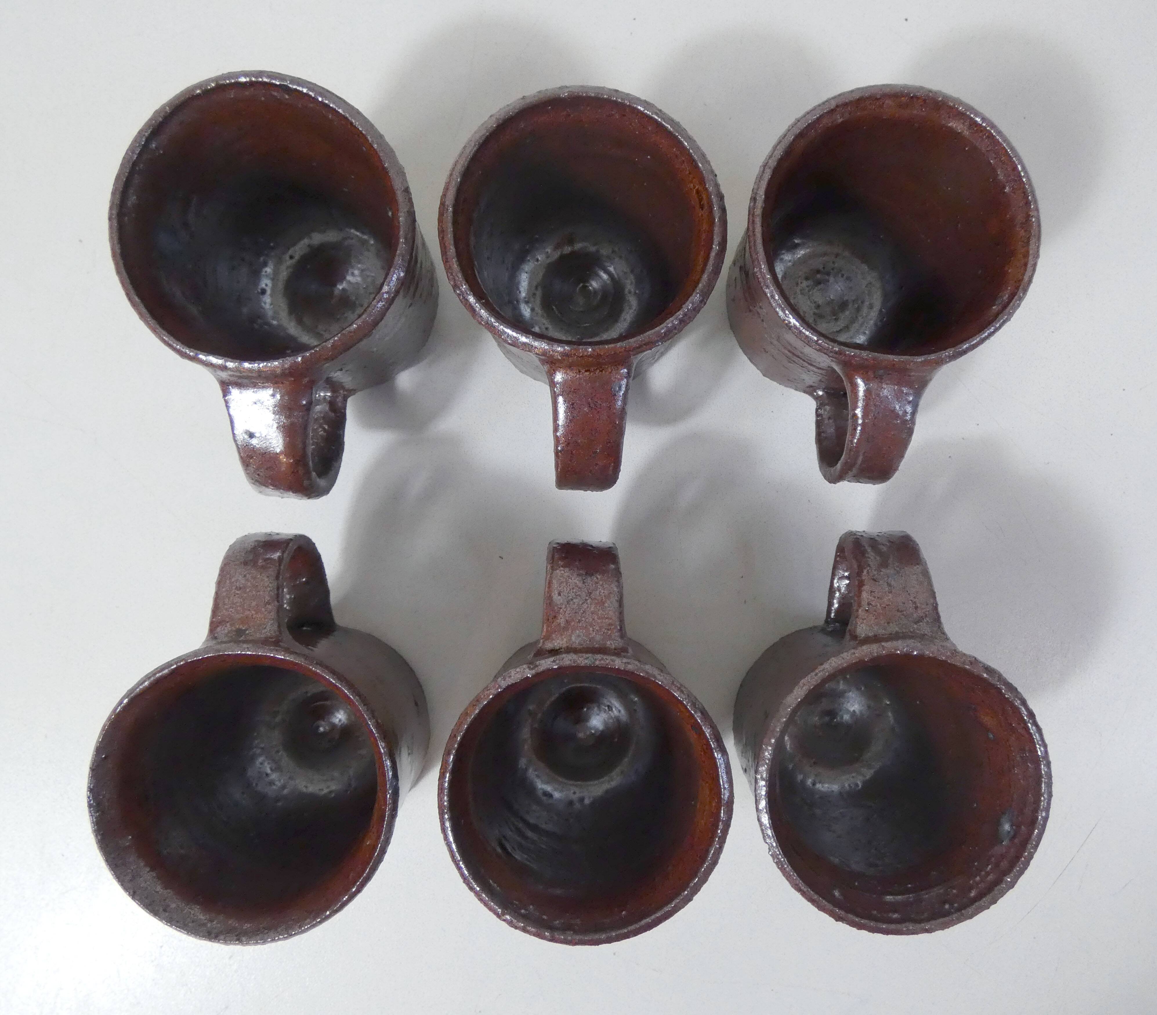 coffee service in iridescent stoneware cups and vintage sugar bowl