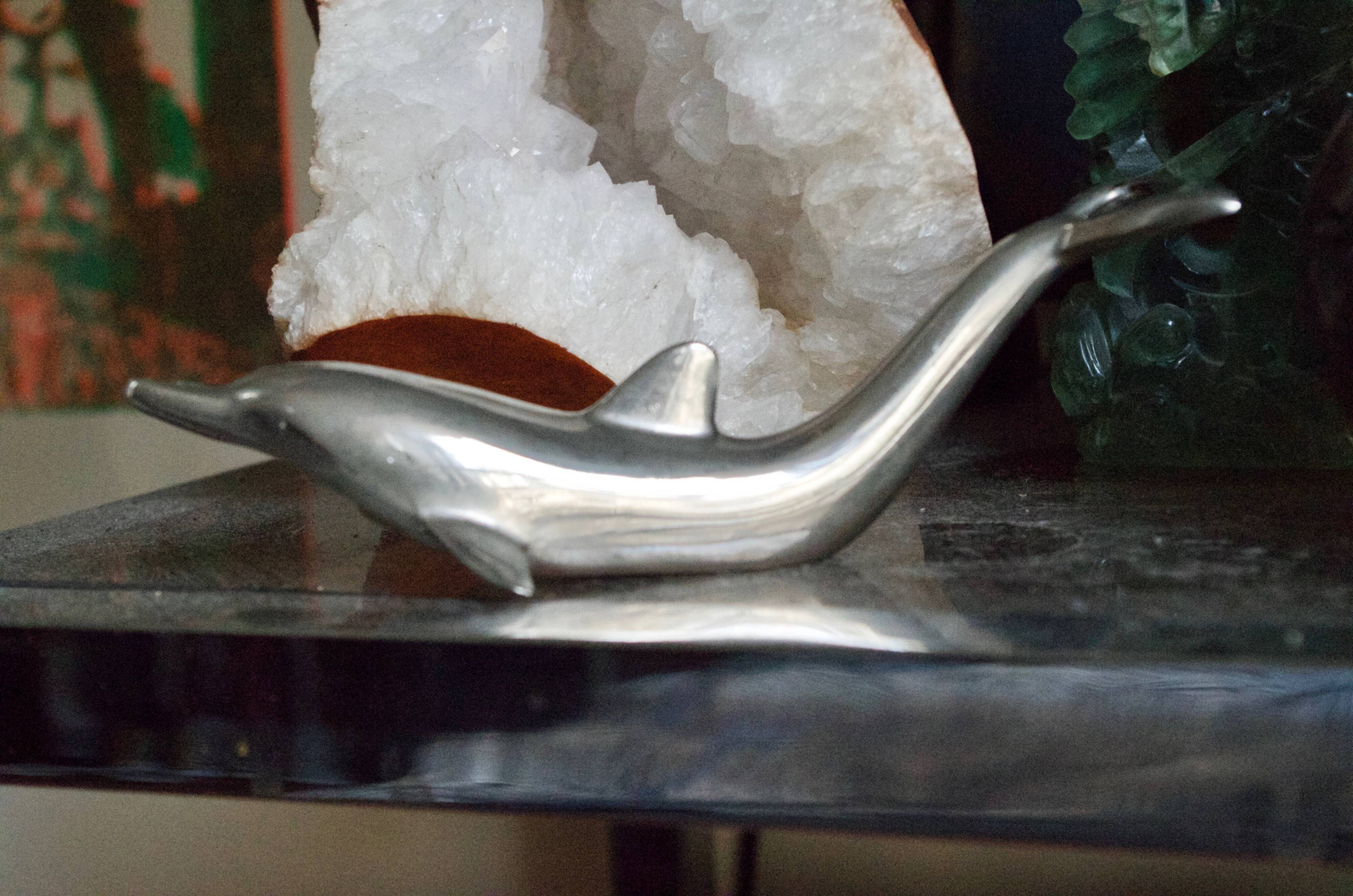 Vintage metal bottle opener dolphin